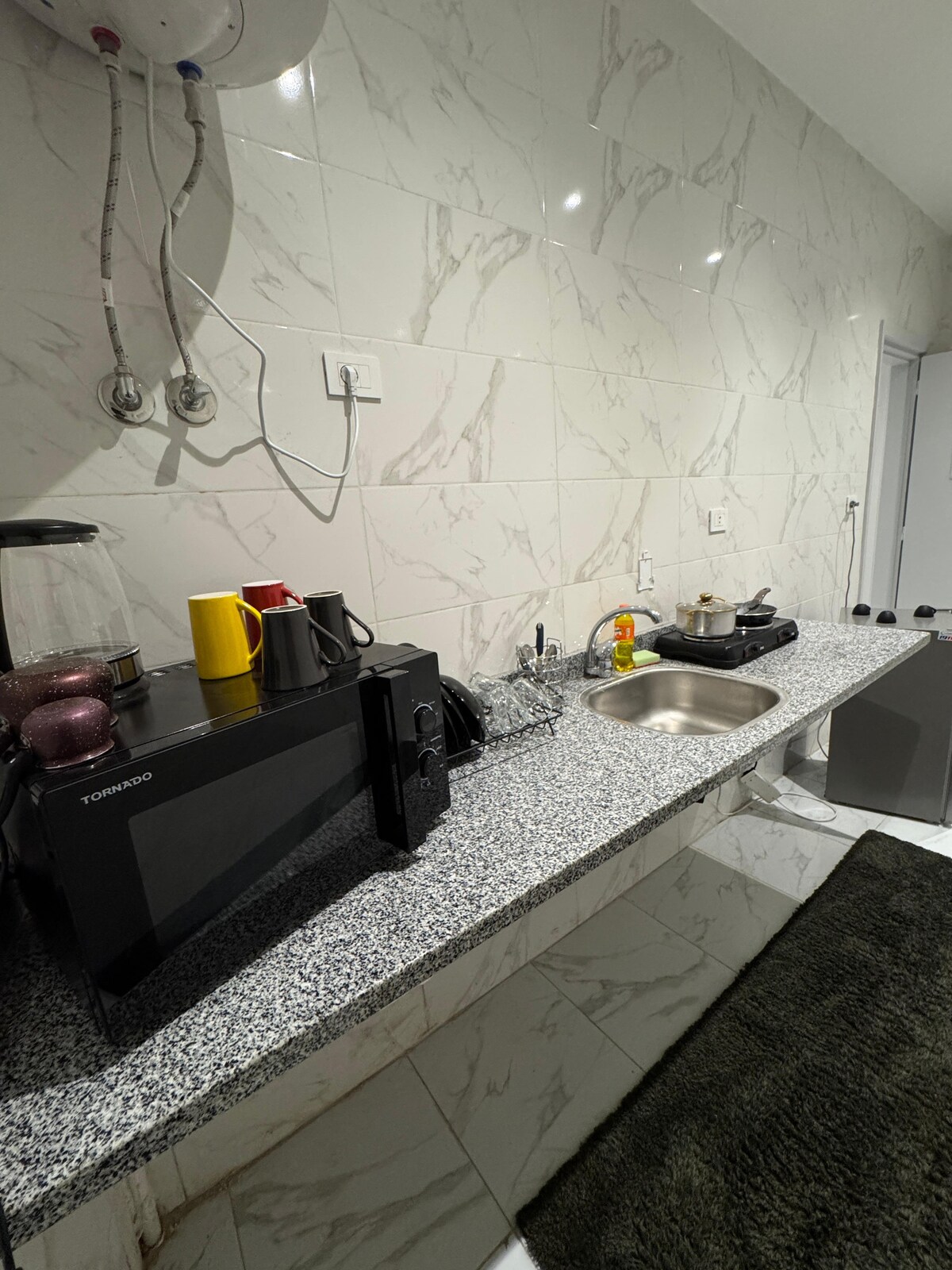 Kitchenette — kettle and boiler on the counter
